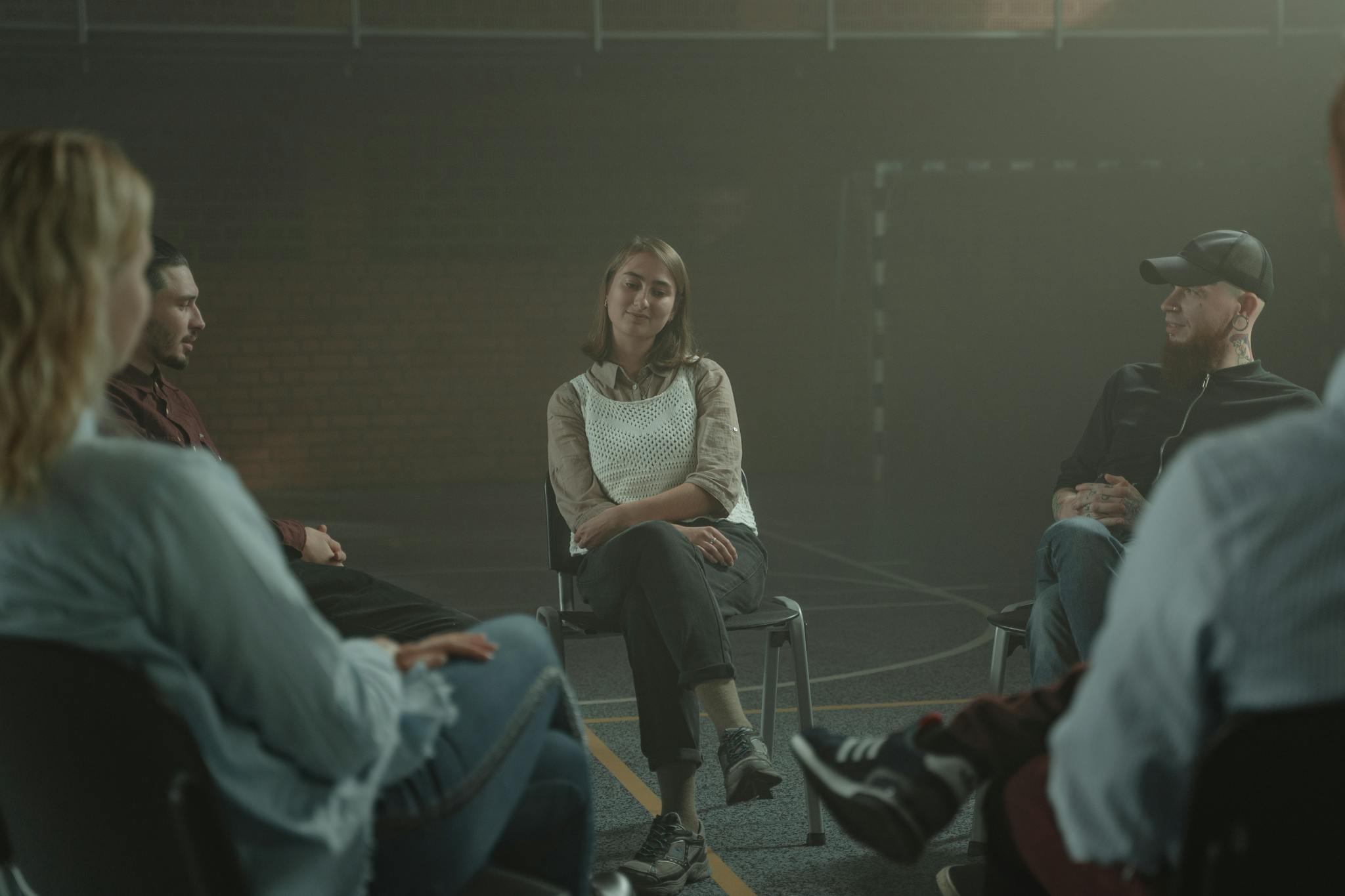 Woman in White Sweater Sitting on Chair